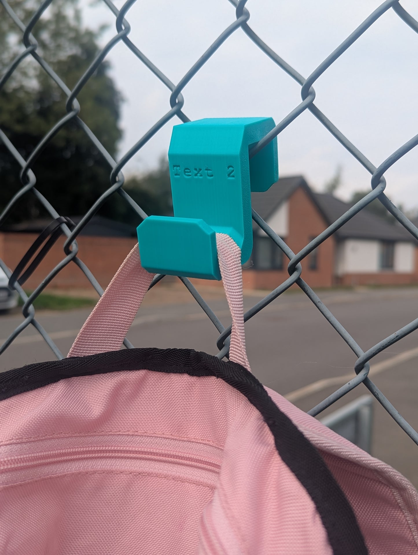 Sports bag fence hook