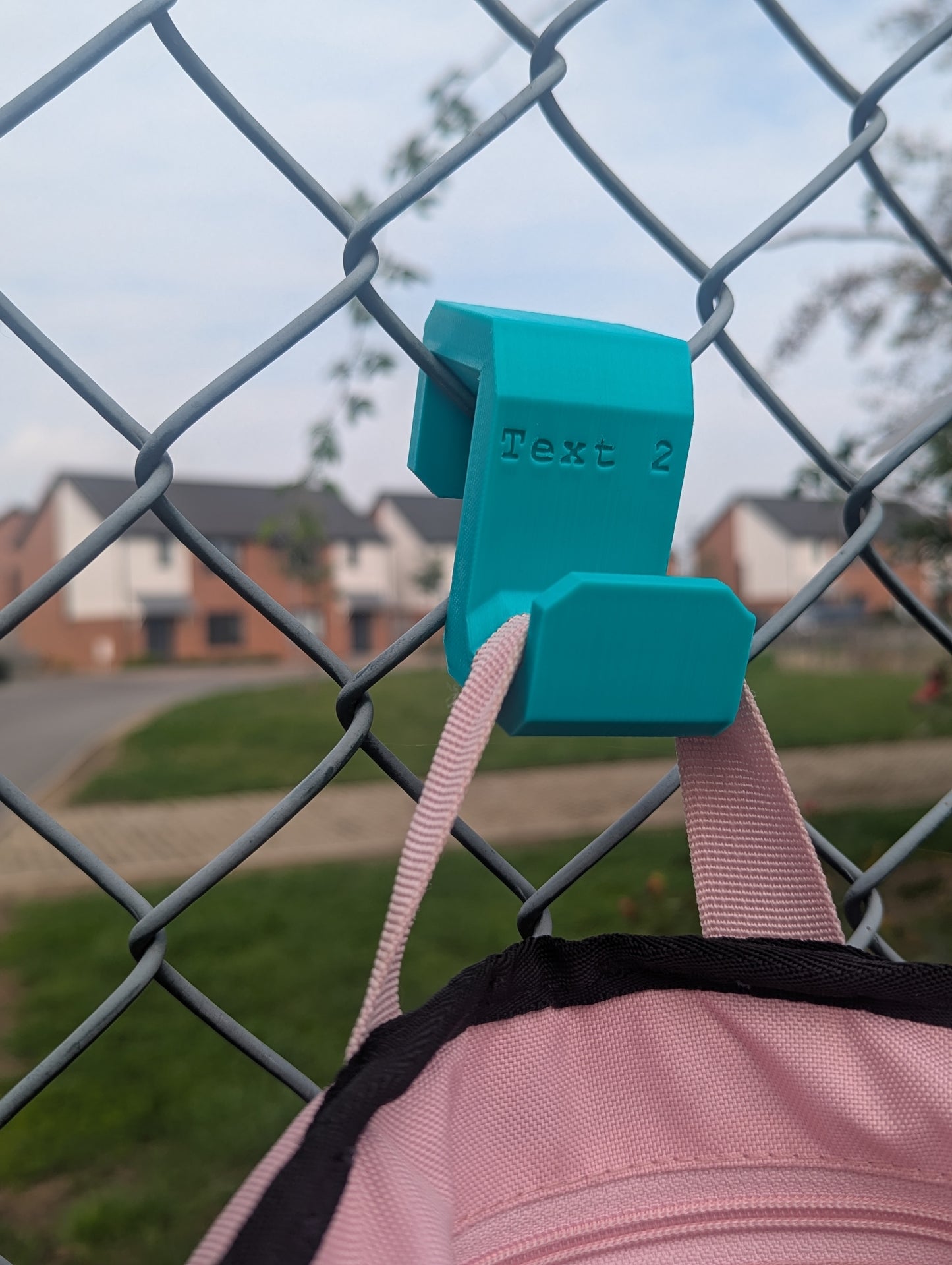 Sports bag fence hook